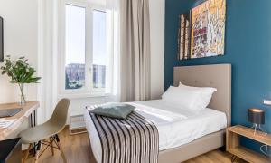 A bed or beds in a room at OTTO Rooms & Photogallery