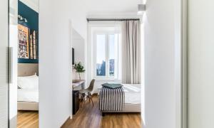 A bed or beds in a room at OTTO Rooms & Photogallery