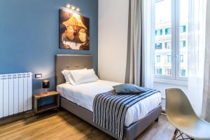 A bed or beds in a room at OTTO Rooms & Photogallery