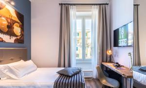 A bed or beds in a room at OTTO Rooms & Photogallery