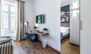 A bed or beds in a room at OTTO Rooms & Photogallery