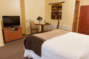 מיטה או מיטות בחדר ב-Apart Hotel Blumenau