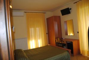 Postel nebo postele na pokoji v ubytování B&B Atlantide + 2 fotografie
