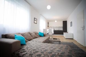 a living room with a couch and a table at Guest house PiN in Laktaši