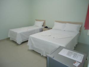 Cama o camas de una habitación en ALIANÇA HOTEL