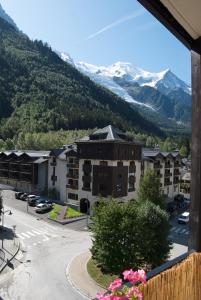 a view from the balcony of a hotel with mountains at Apartment Courmayeur in Chamonix-Mont-Blanc