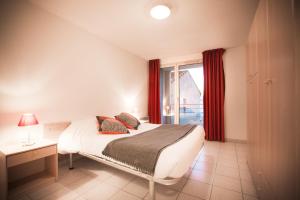 Säng eller sängar i ett rum på City Résidence Avignon (5 Epi)