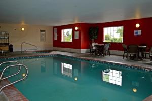 a large swimming pool in a hotel room at Red Lion Inn & Suites Kent - Seattle Area in Kent