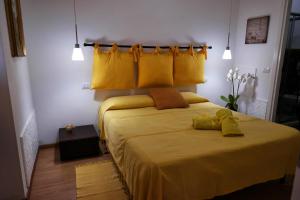Кровать или кровати в номере I Colori di Mag