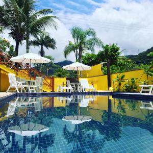 A piscina localizada em Pousada Vila do Sol Juquehy ou nos arredores