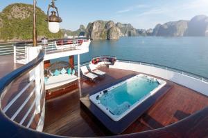 a cruise ship with a hot tub on the deck at Ambassador Halong Cruise in Ha Long
