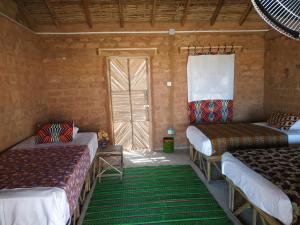 Voodi või voodid majutusasutuse Nguel du Saloum - Chez Abdou et Mar toas