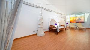 a room with a table and chairs in a museum at FBC Fortuny Resort - Adults Only in Maspalomas
