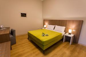 Postel nebo postele na pokoji v ubytování Le Affacciate Bruzie Home Guest House