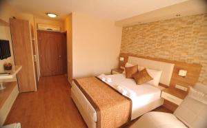 Postel nebo postele na pokoji v ubytování Papirus Hotel