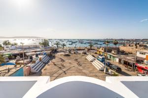 a view of a city with a beach and the ocean at Paracas Hotel Ballestas Island in Paracas