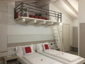 a bedroom with a bunk bed with a ladder at B&B Nuova Ostiglia in Quinto di Treviso