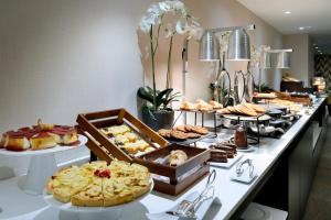 
a buffet table with many different types of food at Eurostars Madrid Gran Vía in Madrid
