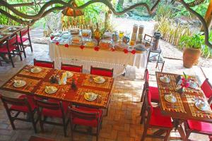 a table set up for a meal on a patio at Pousada Berro do Jeguy in Pipa