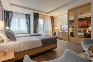 Rubicon Garni Hotel客房内的一张或多张床位