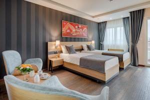 Rubicon Garni Hotel客房内的一张或多张床位