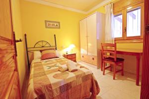 Ein Bett oder Betten in einem Zimmer der Unterkunft El Ventorrillo - holiday home with stunning views and private pool in Benissa