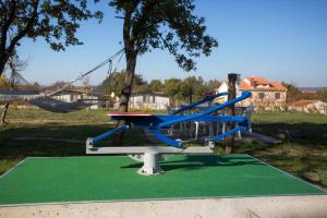 a playground with a slide and a swing at Kamp Romantik - glamping in Labin