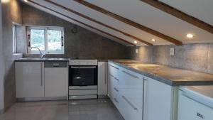 a kitchen with white appliances and a counter top at Kallimos in Vasiliki +65 photos
