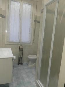 a bathroom with a shower and a toilet at House Procaccini, 20 in Bologna +28 photos