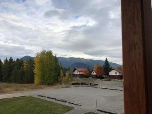 a view of a parking lot with mountains in the background at Great Northern Resort (Lodge) in West Glacier