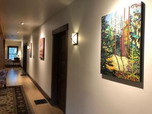 a living room with a painting on the wall at Great Northern Resort (Lodge) in West Glacier