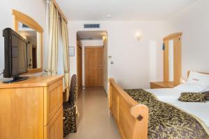 Кровать или кровати в номере Hotel Miramare