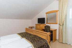 Телевизор и/или развлекательный центр в Hotel Miramare