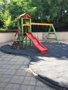 a playground with a slide and a slideintend at Studio Danaya 2 in Varna City