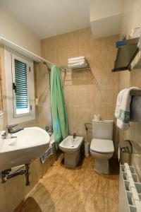 a bathroom with a toilet and a sink at Hotel La Rambla in Biescas