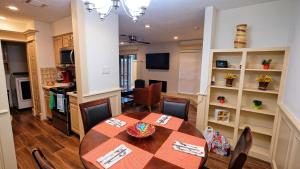 a kitchen and dining room with a table and chairs at Galleria Area Condo, 2 Bedrooms 2 Story - Ocee in Houston