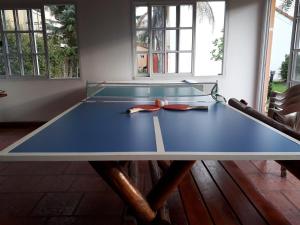 a ping pong table in a room with at Las Glicinas in Federación