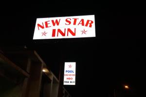 a new star inn sign next to a building at New Star Inn El Monte, CA - Los Angeles in El Monte