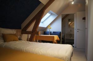 Postel nebo postele na pokoji v ubytování B&B Het Wouwe