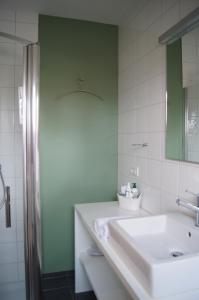 Koupelna v ubytování B&B Het Wouwe