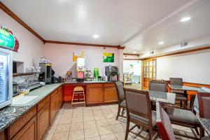a fast food restaurant with a counter and chairs at Quality Inn in Dodge City