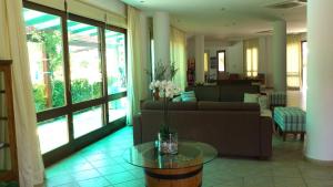 a living room with a couch and a table at Hylatio Tourist Village in Pissouri