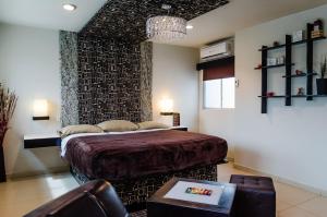 מיטה או מיטות בחדר ב-Hotel Velario