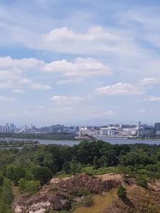a view of a river with a city in the background at V’Auliya Residence in Putrajaya