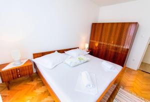 Postel nebo postele na pokoji v ubytování Apartment Stane