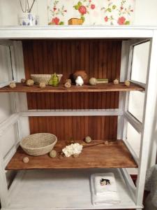 a shelf with a basket and other items on it at Doña Irene B & B in Rancagua