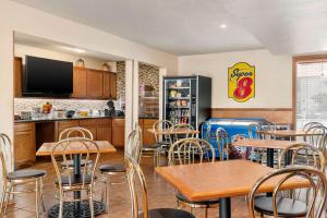 a fast food restaurant with tables and chairs at Super 8 by Wyndham Waco University Area in Waco