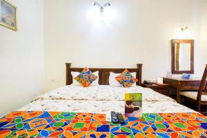 Postel nebo postele na pokoji v ubytování Hotel Raj Kothi Jaipur airport