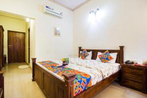 Postel nebo postele na pokoji v ubytování Hotel Raj Kothi Jaipur airport