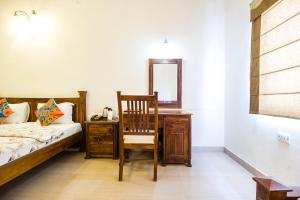 Postel nebo postele na pokoji v ubytování Hotel Raj Kothi Jaipur airport